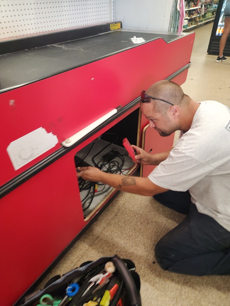 Handyman Hendrix diagnosing an electrical repair at a retail store
